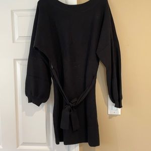 Short black ribbed dress with long sleeves